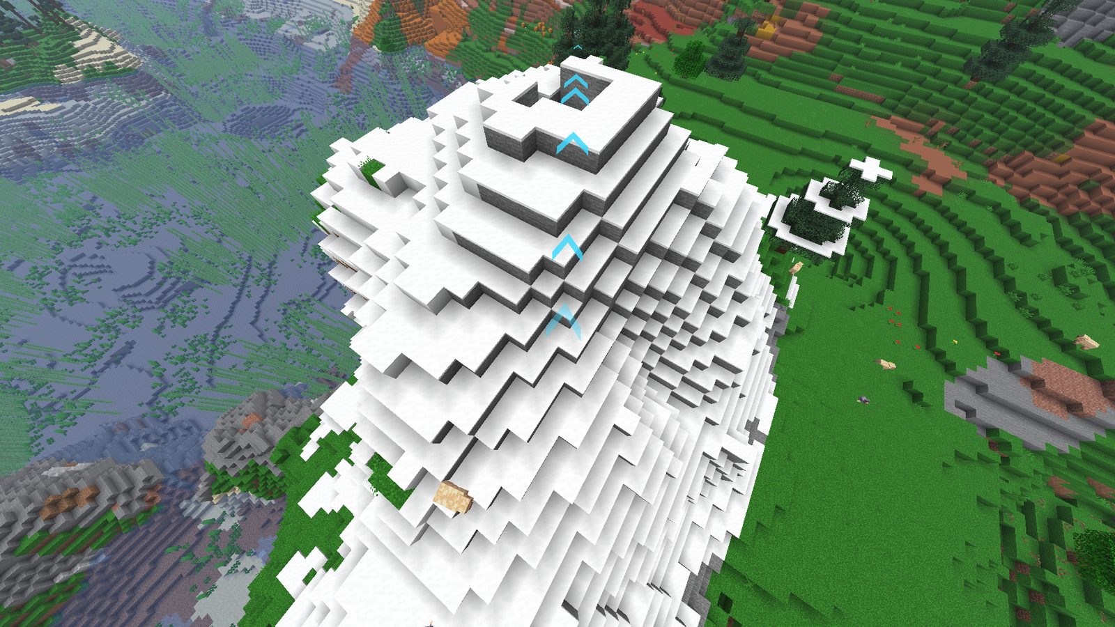 Aerial view of an arrow trail crossing snow, mesa, and forest biomes